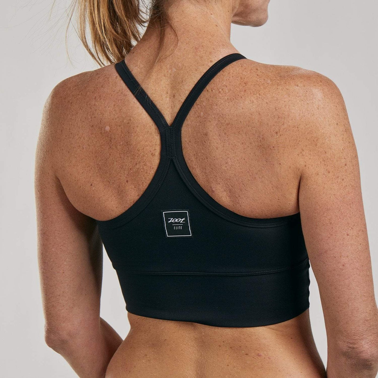 גוזיית נשים ZOOT WOMENS ELITE RUN CROP - ELITE